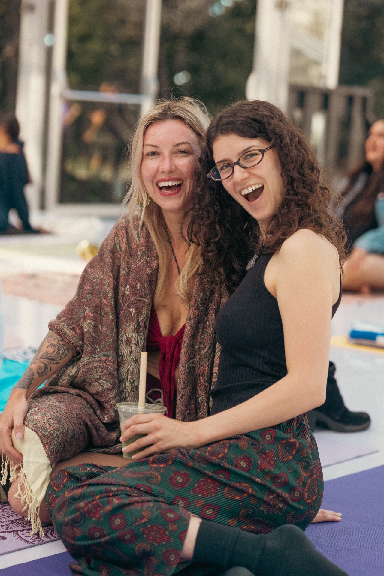 Two friends laughing after the session